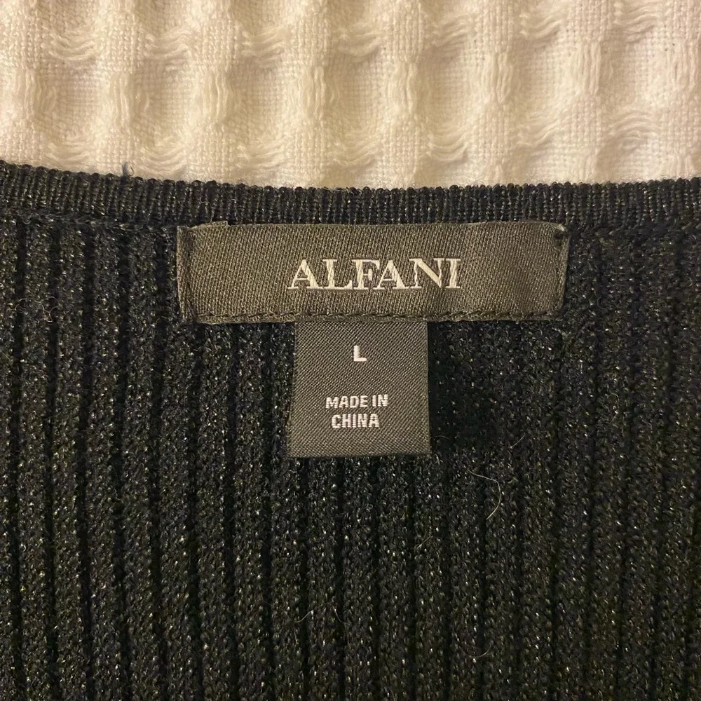 Long sleeved, stretchy shirt. Neckline- V-neck. Color- Black and shimmery. - Picture 3 of 3